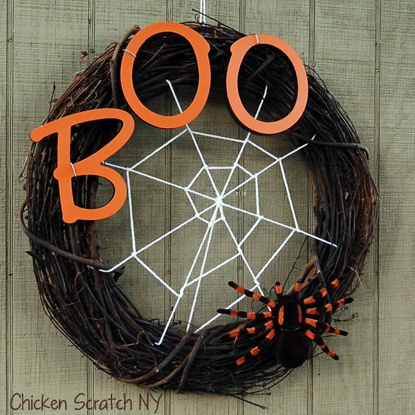 Halloween Wreath.jpg - As the spooky season approaches, there's nothing quite like getting into the Halloween spirit by crafting your own decorations. One of the most impactful ways to welcome trick-or-treaters and guests is with a creative wreath that exudes both charm and a touch of fright.