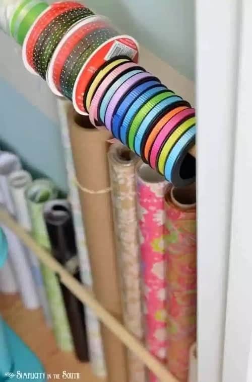 Use dowel rods and curtain rod brackets for wrapping supplies.jpg - Crafting is a joyful expression of creativity, but it comes with the challenge of organizing an ever-growing collection of supplies. For those who love to craft, keeping everything tidy and accessible is essential.