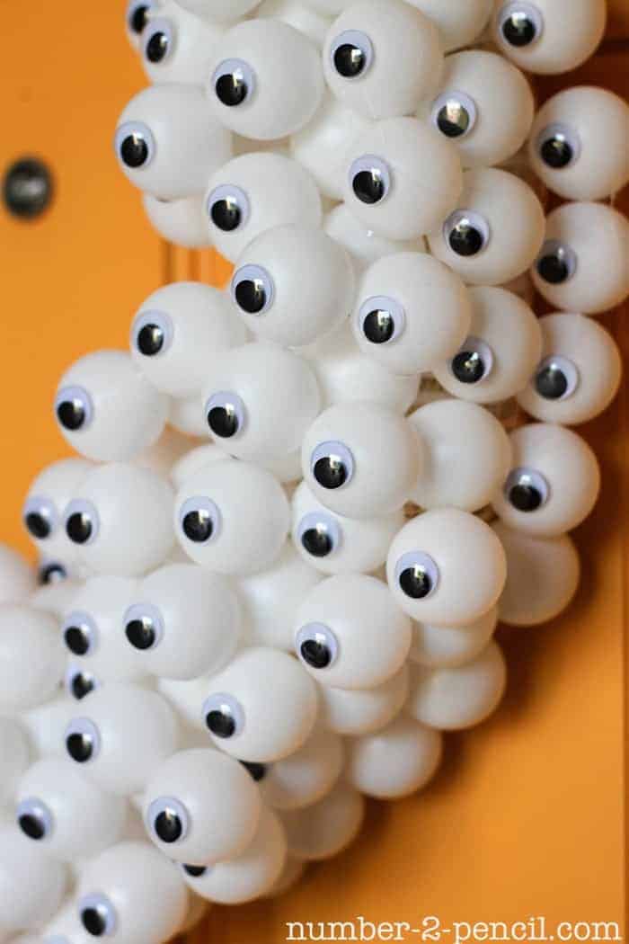 google eye wreath 3 - As the spooky season approaches, there's nothing quite like getting into the Halloween spirit by crafting your own decorations. One of the most impactful ways to welcome trick-or-treaters and guests is with a creative wreath that exudes both charm and a touch of fright.