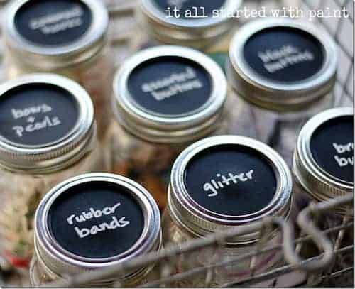 mason jar craft storage with chalkboard paint lids thumb 2 - Crafting is a joyful expression of creativity, but it comes with the challenge of organizing an ever-growing collection of supplies. For those who love to craft, keeping everything tidy and accessible is essential.