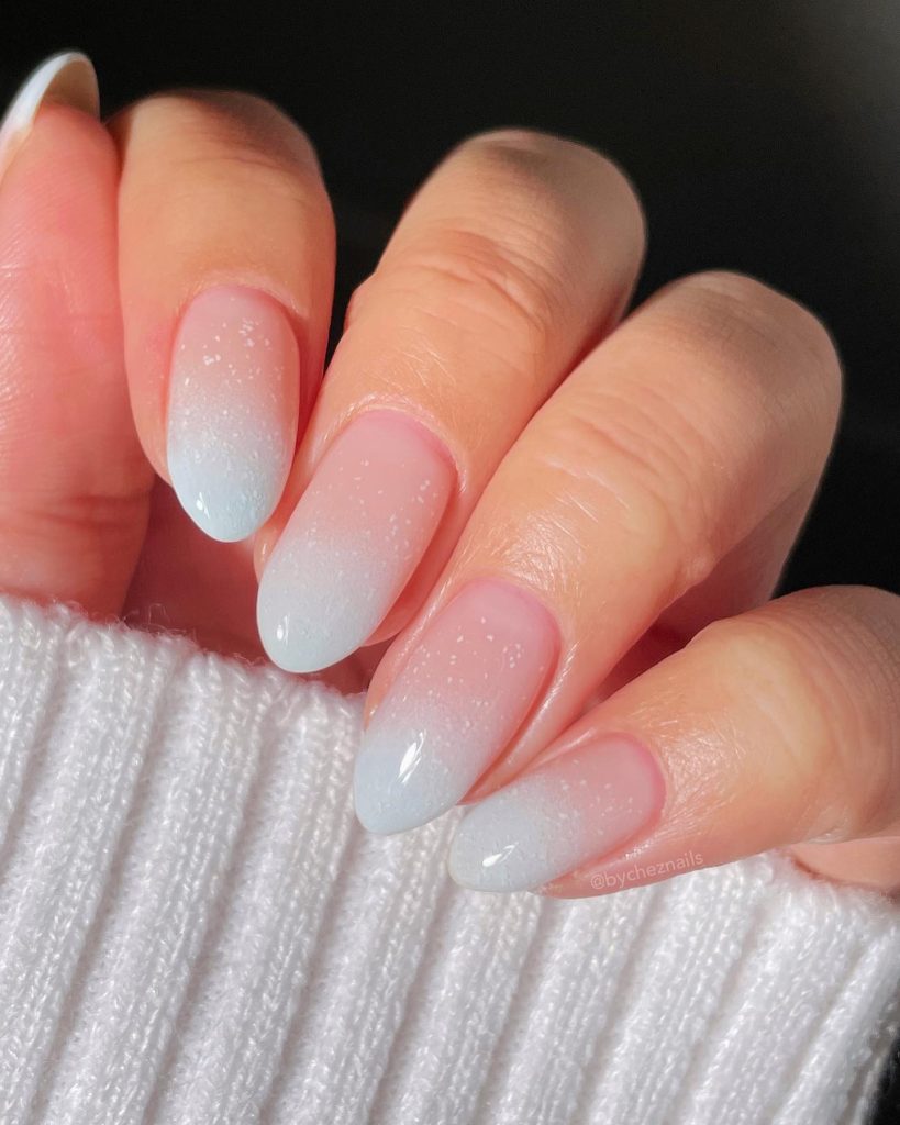 00002 Snow Nails - I remember the first time I experimented with snow nail ideas for winter—it was a chilly evening, and I wanted my nails to reflect the beauty of freshly fallen snow. The shimmering whites, icy blues, and delicate snowflake patterns felt like the perfect way to embrace the season. Since then, I’ve been obsessed with trying different snow nail designs, from soft, frosty gradients to intricate snow-covered details. There’s something magical about winter nails that instantly make your hands look elegant and festive.