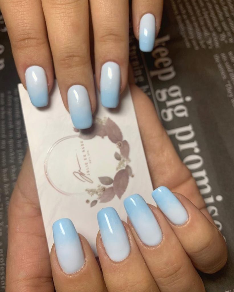 00005 Blue Ombre Nails - I always felt drawn to classy blue ombre nail ideas because the blend of elegance and boldness just feels so right. Whether it was for weddings, brunches or just to make errands feel prettier, blue ombre nails gives me a confidence like no other.