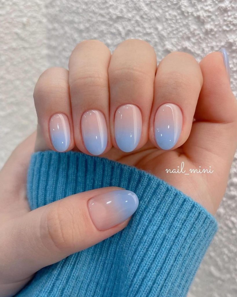 00018 Blue Ombre Nails - I always felt drawn to classy blue ombre nail ideas because the blend of elegance and boldness just feels so right. Whether it was for weddings, brunches or just to make errands feel prettier, blue ombre nails gives me a confidence like no other.